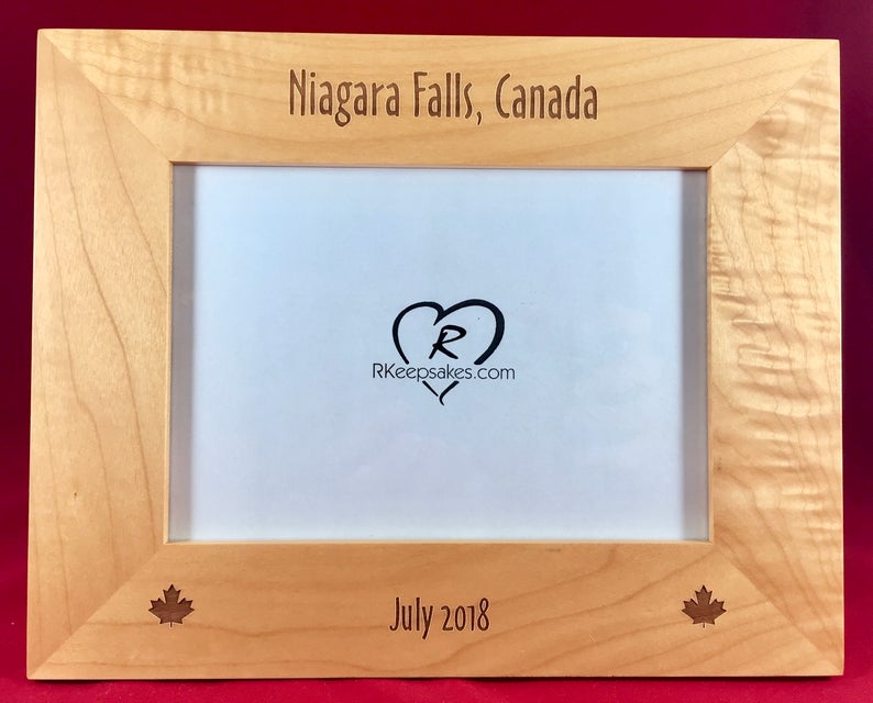 Canada Picture frame with custom text and maple leaf images engraved, in alder