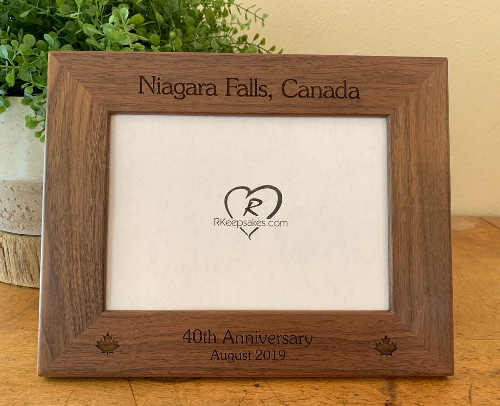 Canada Picture frame with custom text and maple leaf images engraved, in walnut